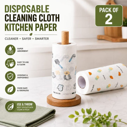 Two rolls of disposable kitchen paper on wooden holders, with one roll standing upright and the other lying on its side. The paper has a white base with small multicolor kitchen-themed illustrations.