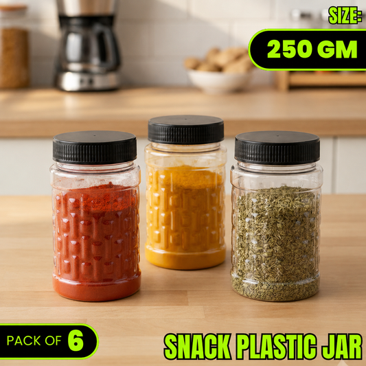 Three clear plastic snack jars with black lids, filled with red chili powder, yellow turmeric powder, and green dried herbs, displayed on a wooden countertop with a blurred kitchen background. Text overlays read 'SIZE: 250 GM', 'PACK OF 6', and 'SNACK PLASTIC JAR'.